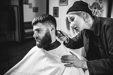 Image showing Client during beard shaving in barber shop