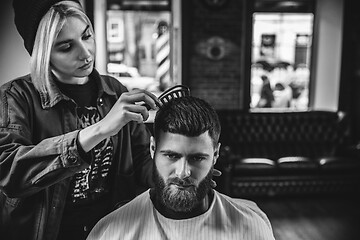 Image showing Client during beard shaving in barber shop