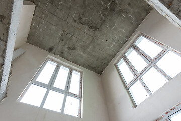 Image showing Second light in a two-level apartment from the developer, bare walls with plastic windows