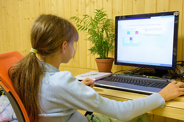 Image showing A student passes distance learning tasks on a computer