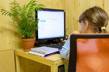 Image showing A student learns lessons in a computer with online distance learning