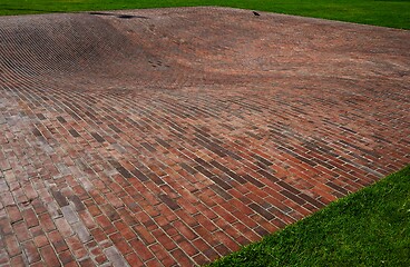 Image showing concave red brick platform