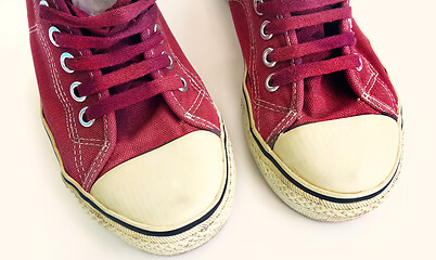 Image showing Old crimson sneakers