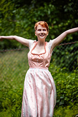 Image showing Happy young woman in a dirndl