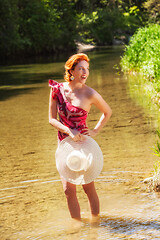 Image showing Woman in bathing suit and hat in hand