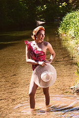 Image showing Woman in swimsuit and red hair