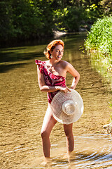 Image showing Sexy redheaded woman in bathing suit 