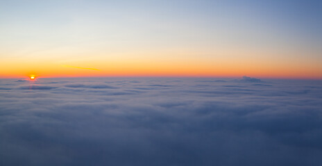 Image showing Amazing sunrise above clouds from the top of the mountain 