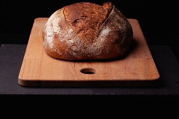 Image showing Artisan sourdough bread. on the black background. 