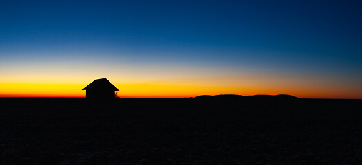 Image showing Old barn on the field at sunrise