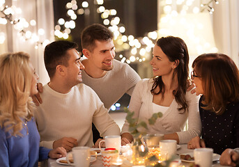 Image showing happy family having tea party at home