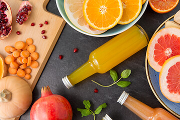 Image showing glass bottles of fruit and vegetable juices