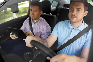 Image showing car driving school instructor and young driver