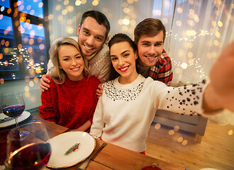 Image showing friends taking selfie at christmas dinner