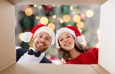 Image showing happy couple opening christmas gift box