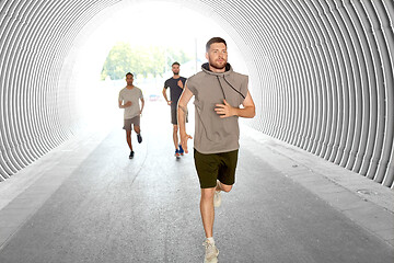 Image showing young men or male friends running outdoors