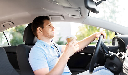 Image showing man or driver with takeaway coffee cup driving car