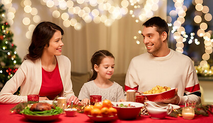 Image showing happy family having christmas dinner at home