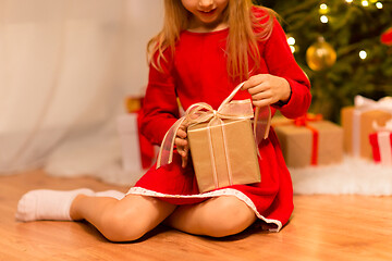 Image showing close up of girl with christmas gift at home