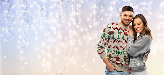 Image showing happy couple at christmas ugly sweater party