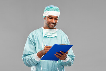 Image showing indian male doctor or surgeon with clipboard