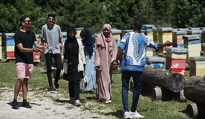 Image showing people group visiting local honey production farm