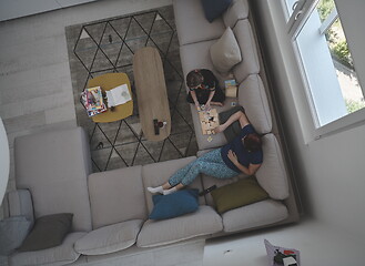 Image showing mother and daughter at home playing memory game