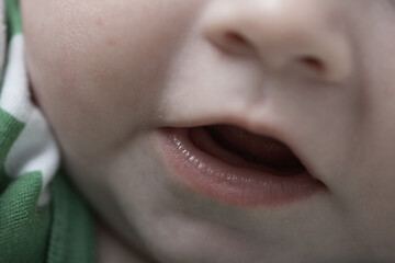 Image showing cute little baby playing with hands and smiling