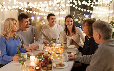 Image showing happy family having tea party at home