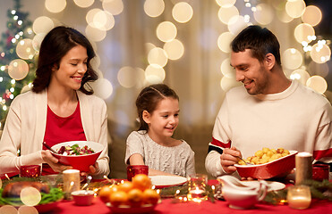 Image showing happy family having christmas dinner at home