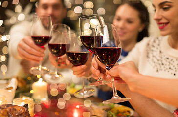 Image showing close up of friends with wine celebrate christmas