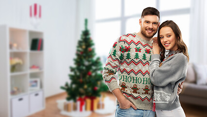 Image showing happy couple at christmas ugly sweater party