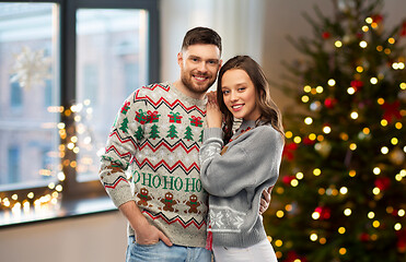 Image showing happy couple at christmas ugly sweater party