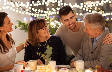 Image showing happy family having tea party at home