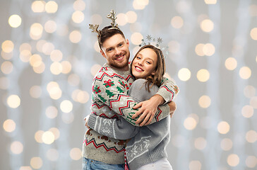 Image showing happy couple at christmas ugly sweater party