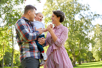 Image showing happy family having fun at summer park