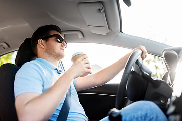 Image showing man or driver with takeaway coffee cup driving car
