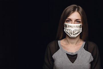 Image showing Woman wearing protective face mask with sign masks for 100 days in USA, America