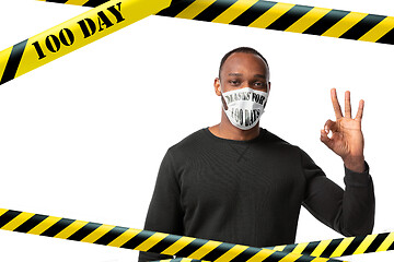 Image showing Man wearing protective face mask with sign masks for 100 days in USA, America