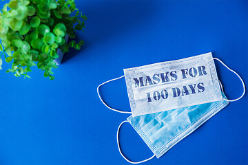 Image showing Essential goods during epidemic - face mask with sign masks for 100 day in America, USA, COVID-19