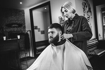 Image showing Client during beard shaving in barber shop