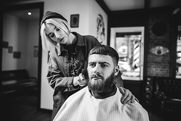 Image showing Client during beard shaving in barber shop