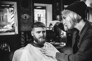 Image showing Client during beard shaving in barber shop