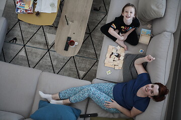 Image showing mother and daughter at home playing memory game