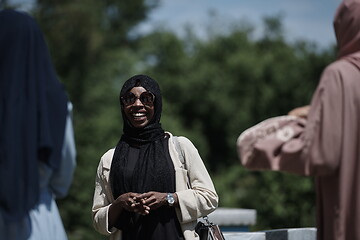 Image showing woman giving presentation to group of business investors on local honey production farm