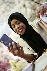 Image showing african woman using smartphone wearing traditional islamic clothes