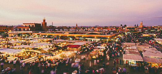 Image showing Jamaa el Fna, Marrakesh, Morocco in colorful sunset.