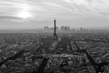 Image showing Aerial view of Paris with Eiffel tower and major business district of La Defence in background at sunset