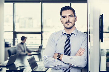 Image showing Team leader with coworkers working in office.