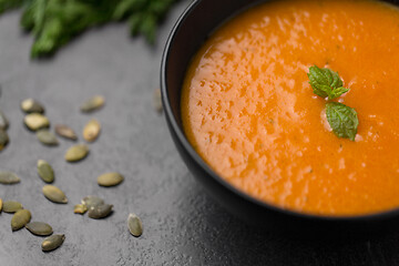 Image showing close up of vegetable pumpkin cream soup in bowl